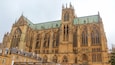 A large Gothic cathedral with intricate architecture, including pointed arches and detailed stonework.