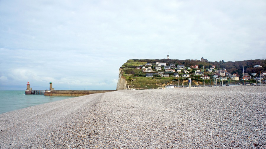 View of famous cliff with houses on it, lighthouse and coastline, commune in the Seine-Maritime department in the Haute-Normandie region, beautiful landscape, beach in Fecamp, France, Shutterstock ID 1041769597, Purchase Order: -