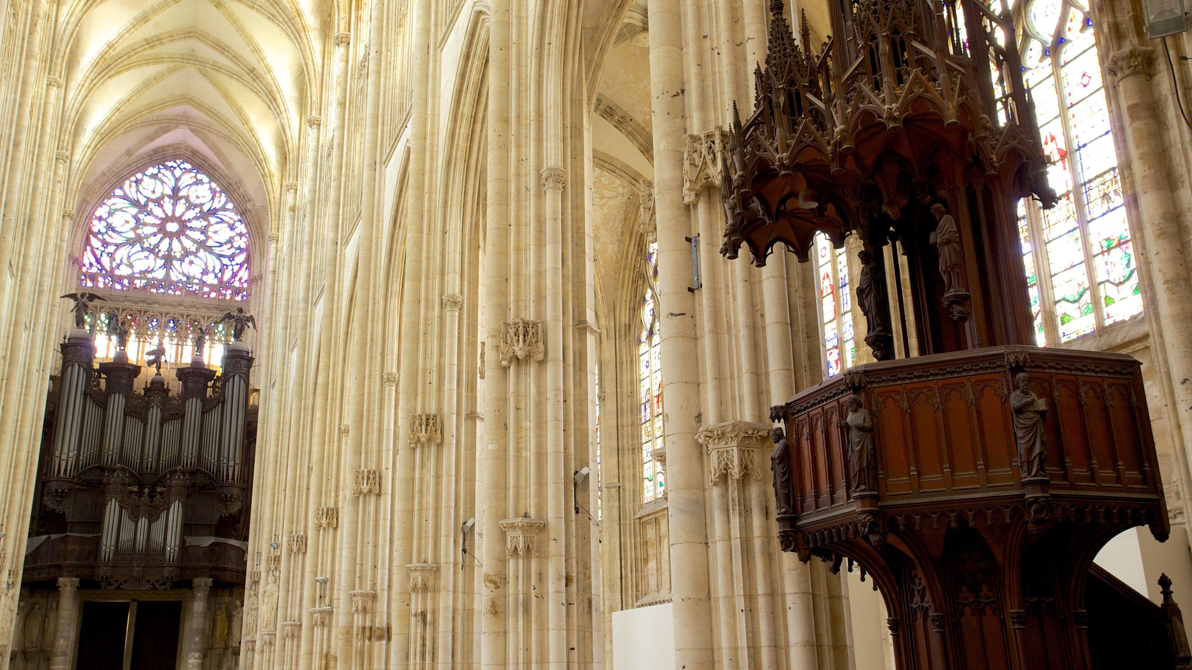 Saint-Ouen Church featuring a church or cathedral and interior views