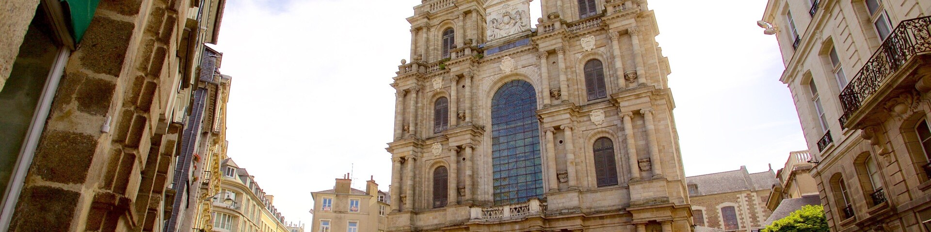 A historic cathedral with two towers and a large central window.