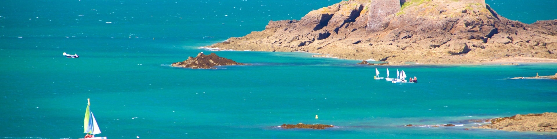 A coastal scene with a lighthouse, a small island with a building, and sailboats on the water.