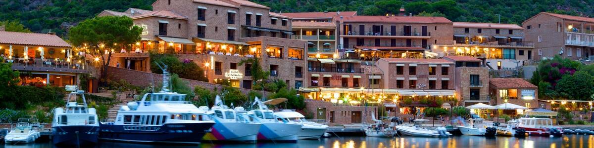 Porto Beach featuring a coastal town, a marina and a sunset