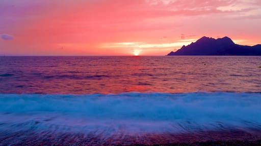 Porto Beach which includes a sunset and general coastal views