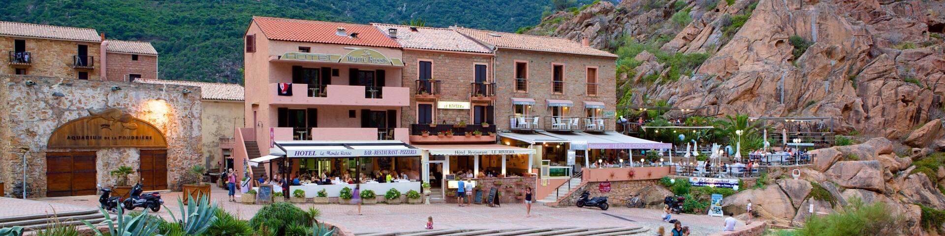 A town square with a hotel, restaurant, and aquarium.