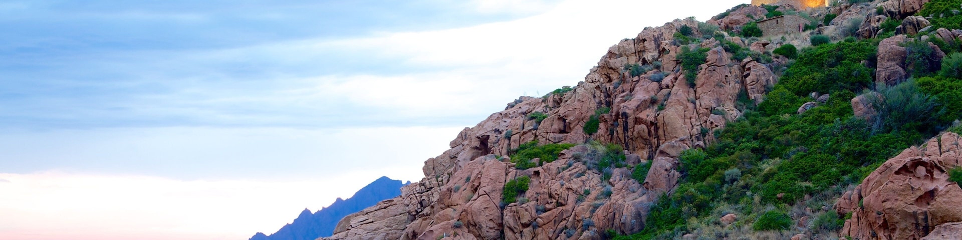 Genoese Tower which includes rocky coastline