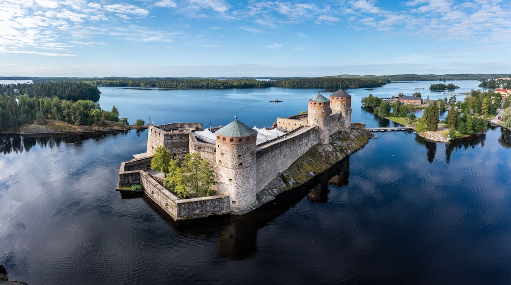 Aerial panorama of Olavinlinna castle and the surrounding lakes in Savonlinna, Finland.
