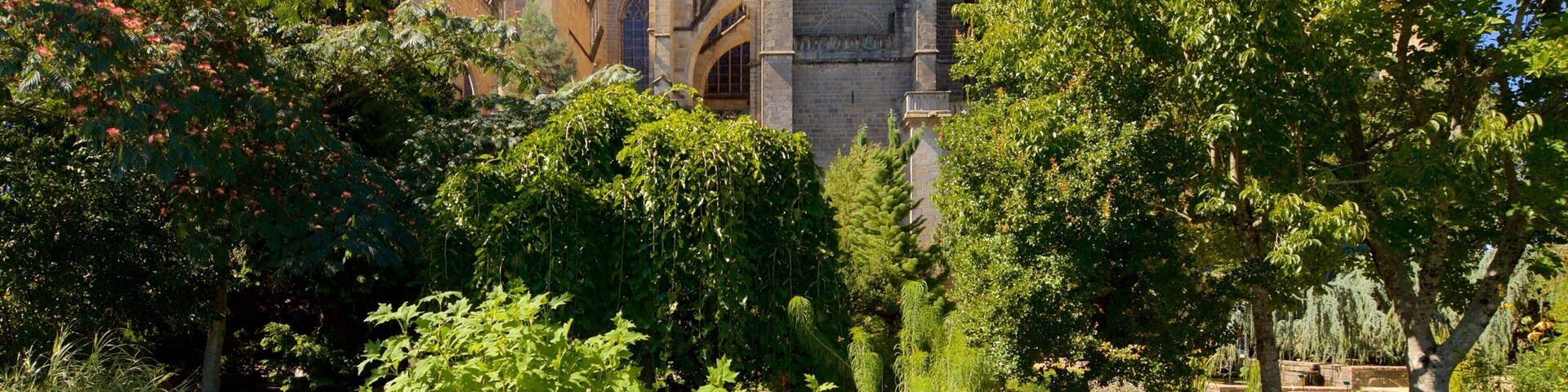 Jardin de l\'Eveche showing a church or cathedral and heritage architecture