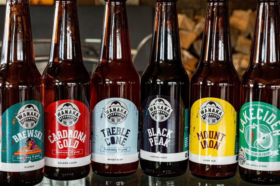 Six bottles of Wanaka beerworks on a shelf.