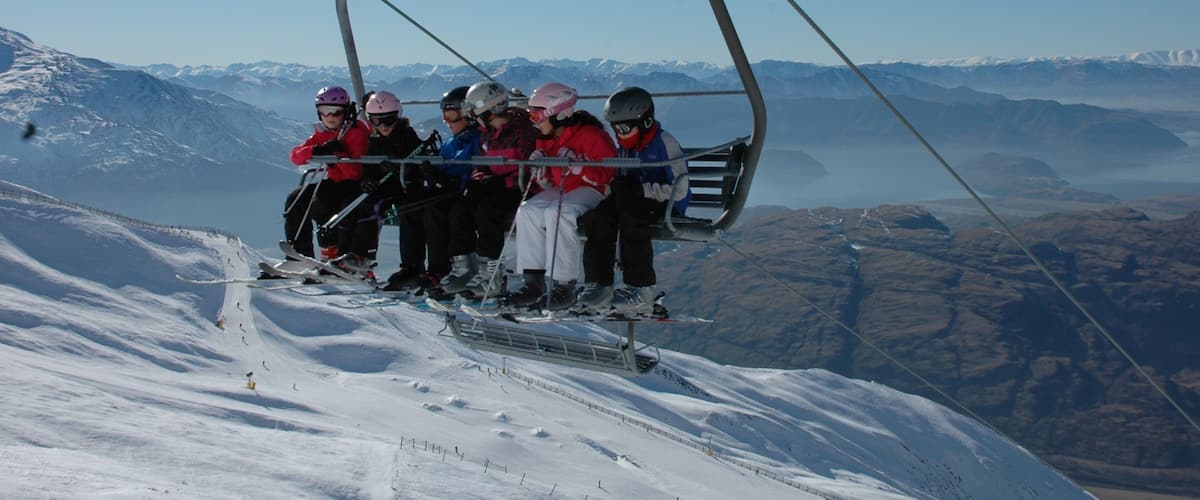 Treble Cone featuring a gondola, snow and snow skiing