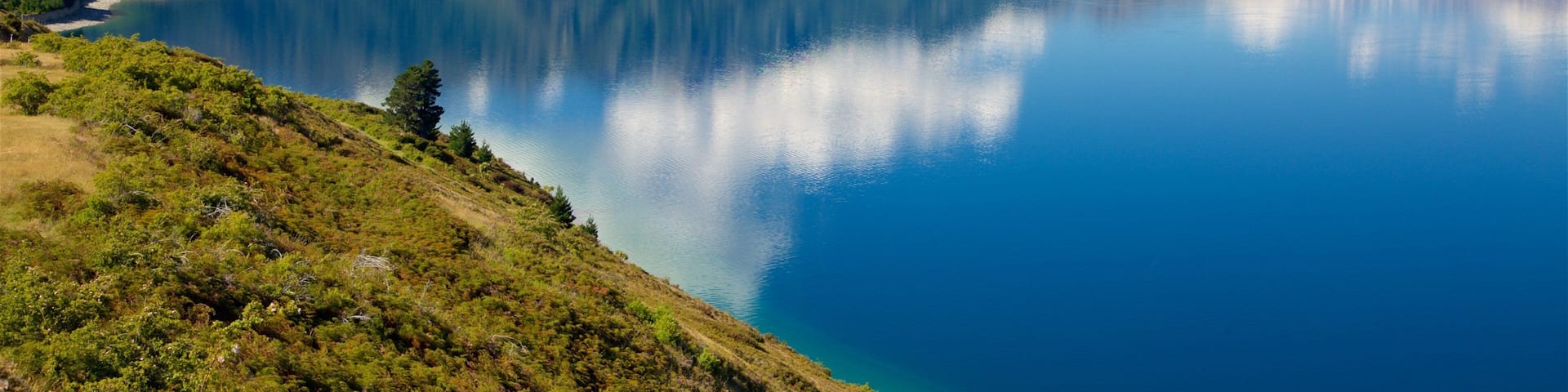 Lake Hawea which includes a lake or waterhole and mountains
