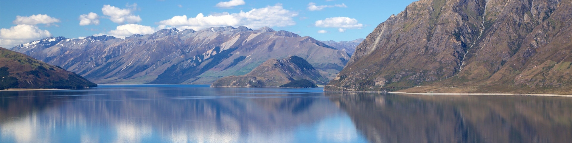 Lake Hawea which includes mountains and a lake or waterhole
