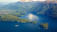Lake Manapouri showing forests, mountains and a lake or waterhole