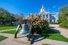 Liberty Bell in front of New Hampshire State House, Concord, New Hampshire NH, USA. New Hampshire State House is the nations oldest state house, built in 1816 - 1819.