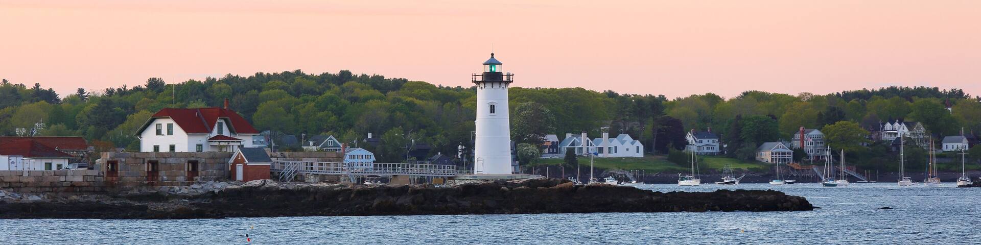 Portsmouth Harbor Lighthouse after sunset. The lighthouse is a historic lighthouse located within Fort Constitution in New Castle, New Hampshire, United States.
