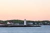 Portsmouth Harbor Lighthouse after sunset. The lighthouse is a historic lighthouse located within Fort Constitution in New Castle, New Hampshire, United States.