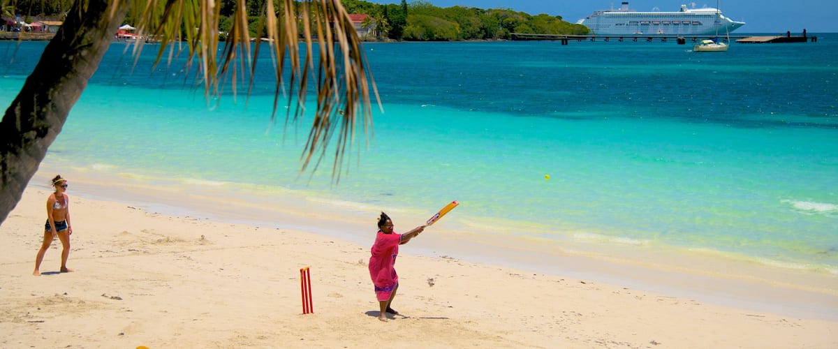 Kuto Beach which includes a sandy beach as well as a small group of people