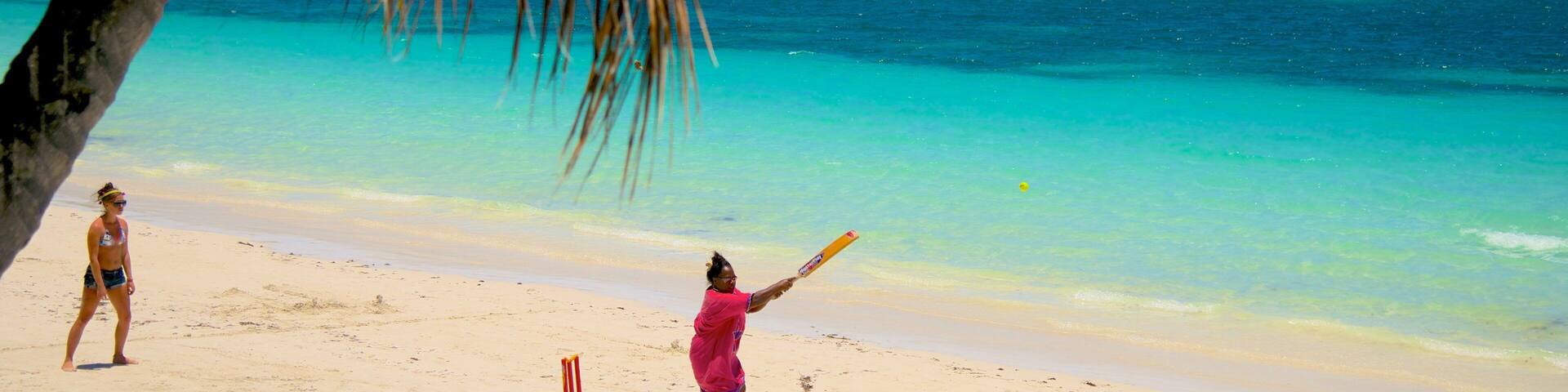 Kuto Beach which includes a beach as well as a small group of people