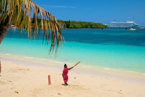 Kuto Beach which includes a beach as well as a small group of people