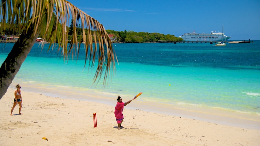 Kuto Beach which includes a beach as well as a small group of people