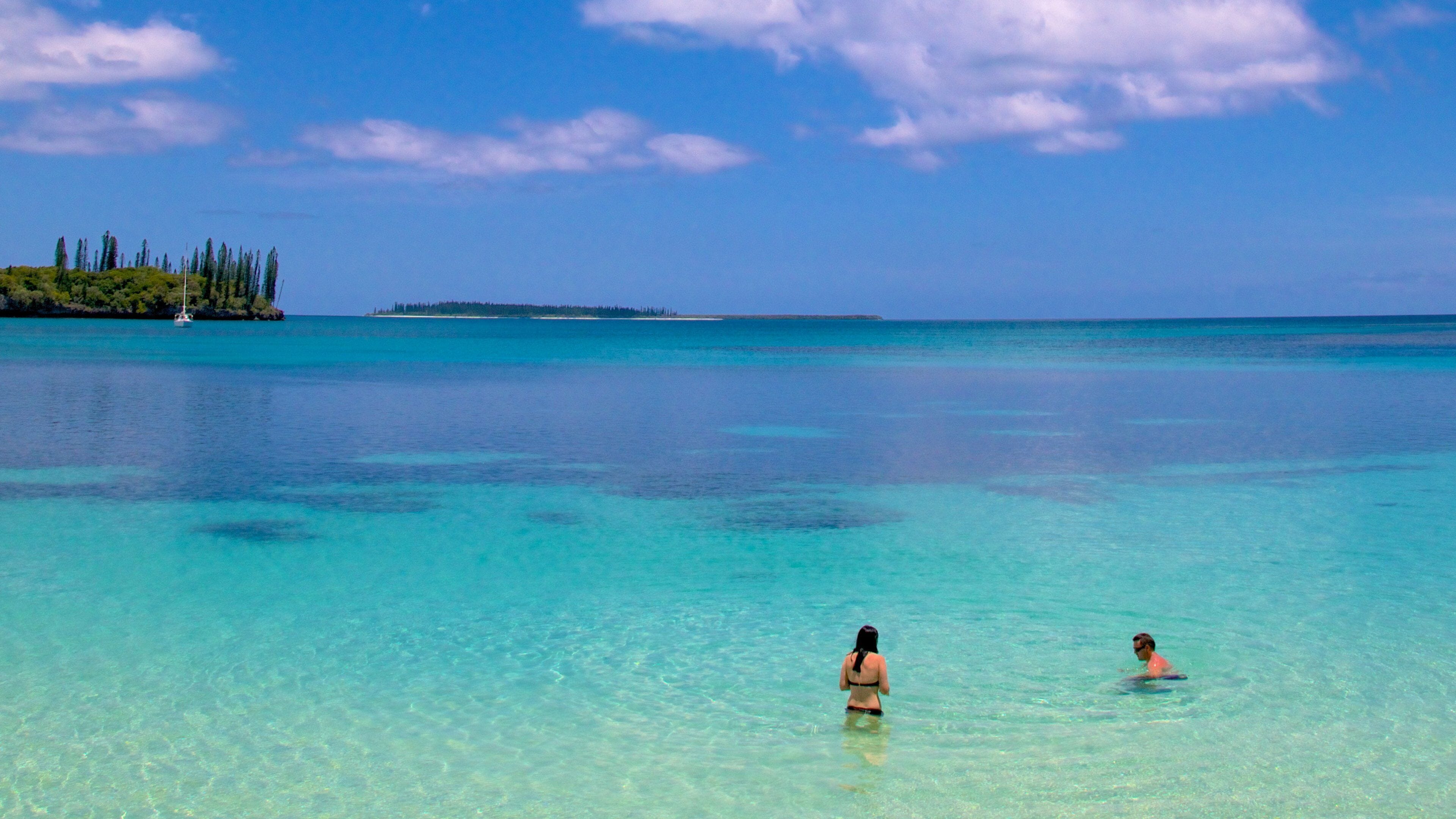 Kanumera Beach showing general coastal views as well as a small group of people