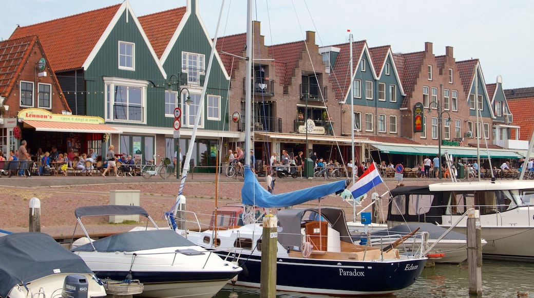 Volendam Harbour showing a coastal town, a bay or harbor and boating
