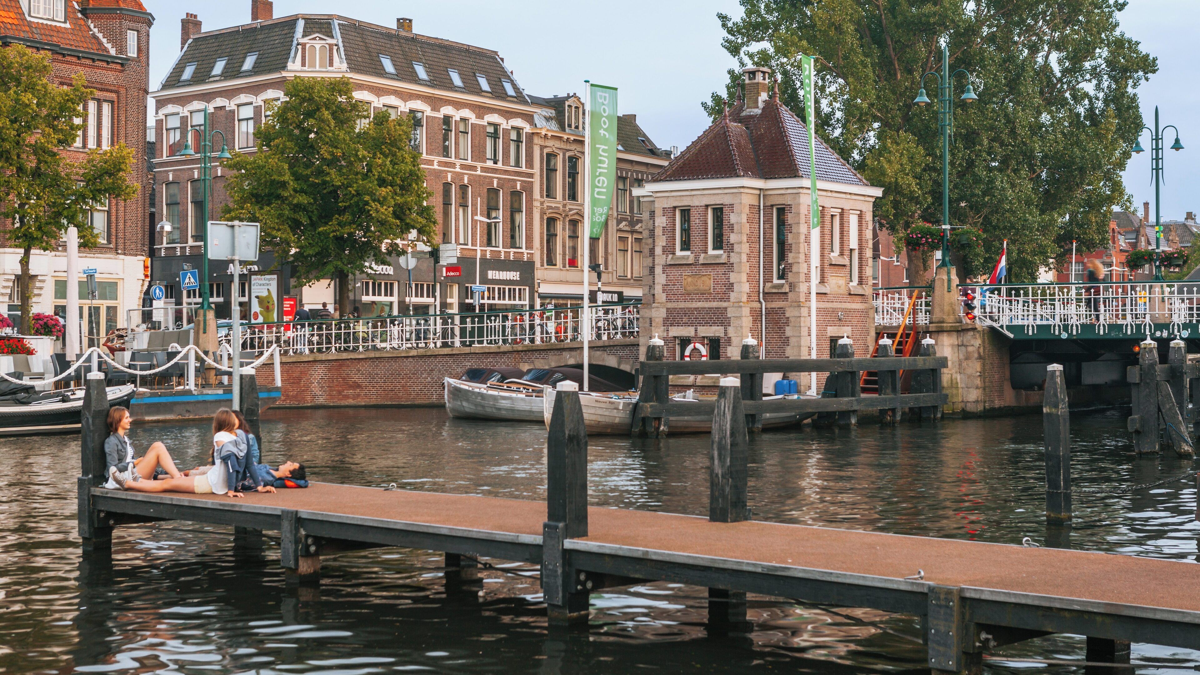 Relaxing moments at Beestenmarkt in Leiden, South Holland, with scenic views of the canals and charming architecture during a sunny day