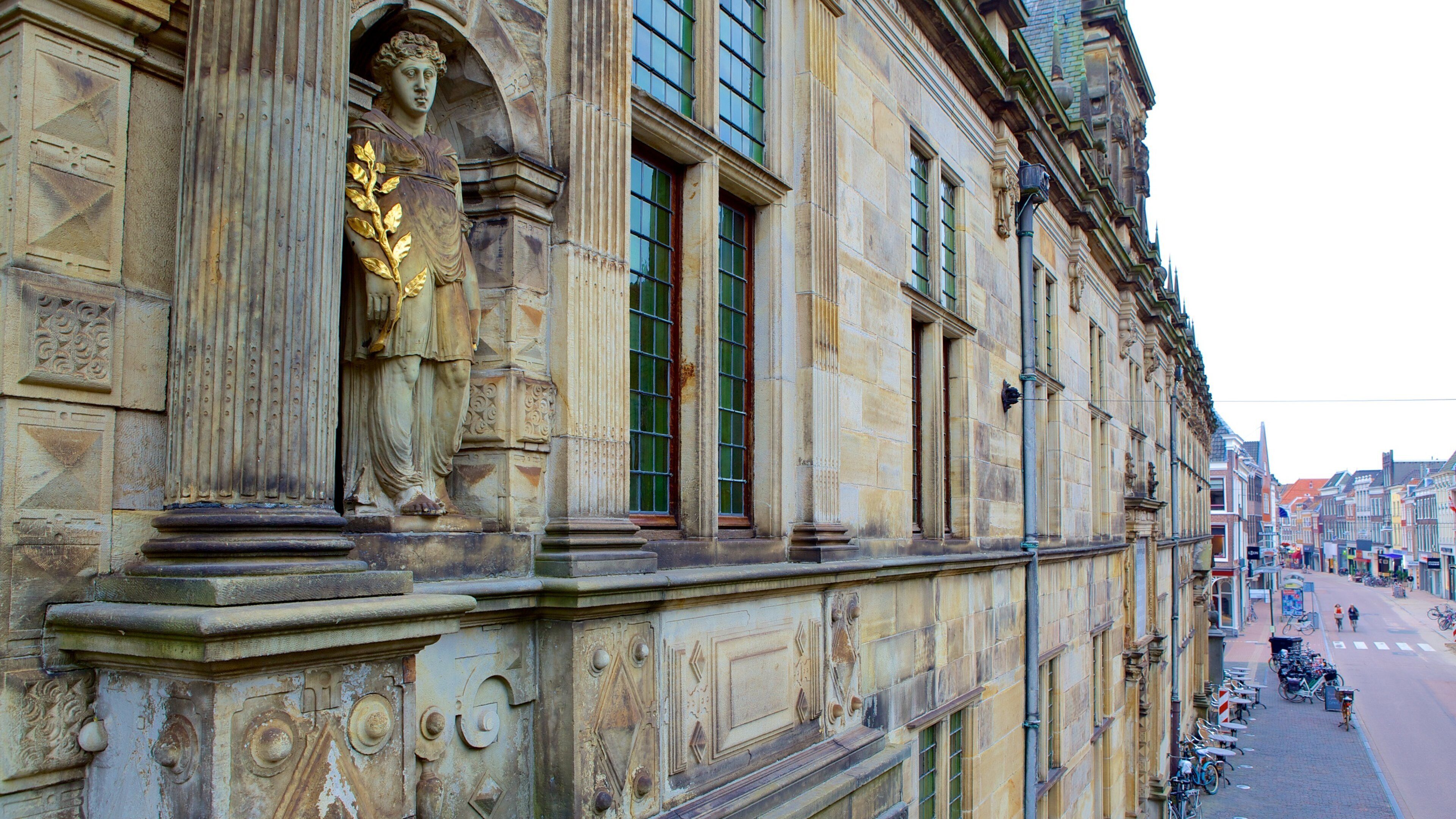 Waag which includes heritage elements and a statue or sculpture