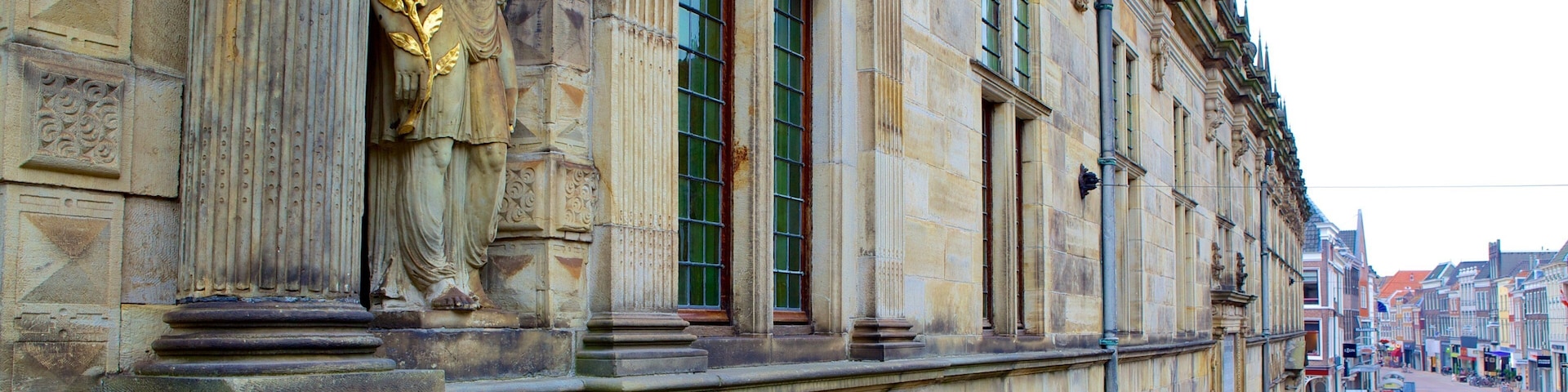 Waag which includes heritage elements and a statue or sculpture