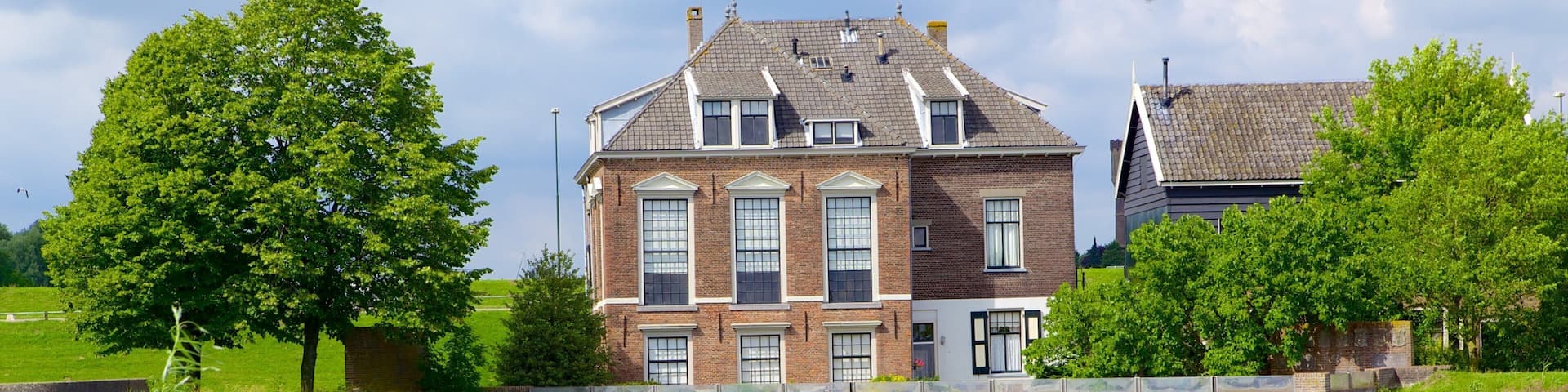Kinderdijk featuring a river or creek and a house