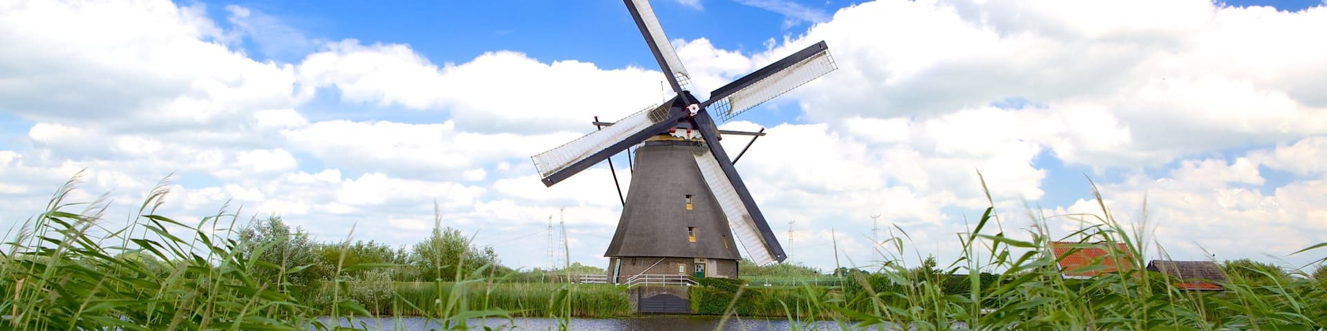 Kinderdijk showing a windmill and a river or creek