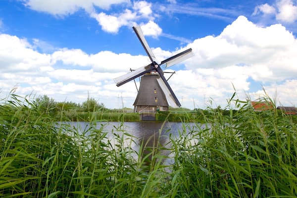 Kinderdijk showing a windmill and a river or creek