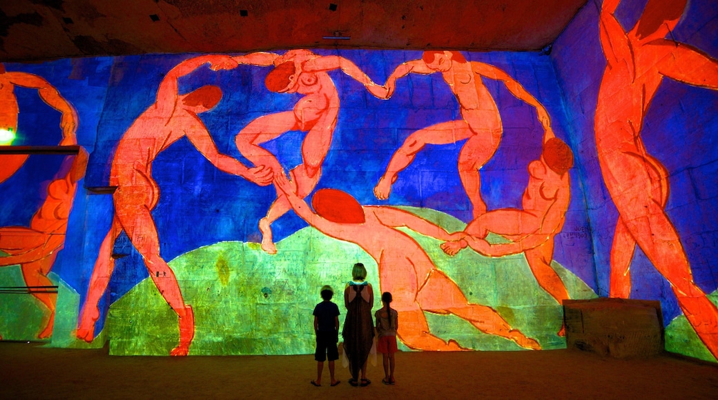 Carrieres de Lumieres featuring art and interior views as well as a family
