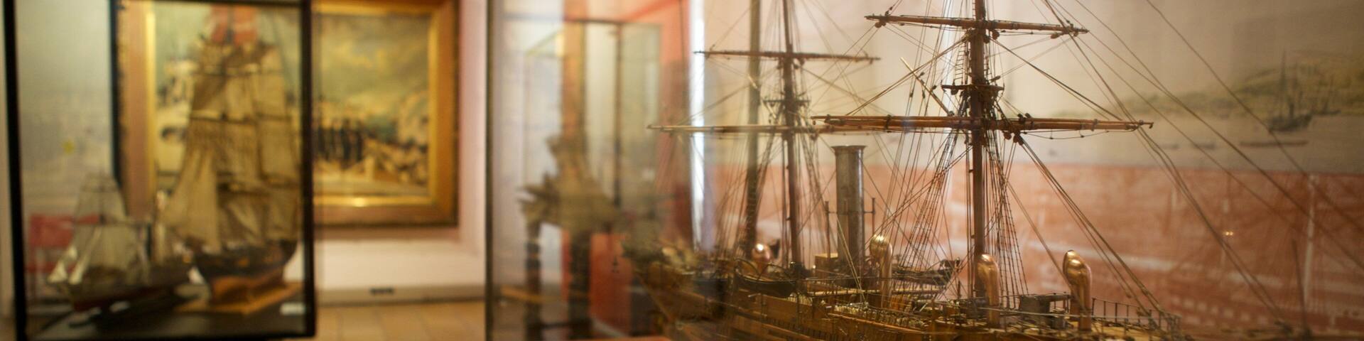 A model ship on display in a museum.