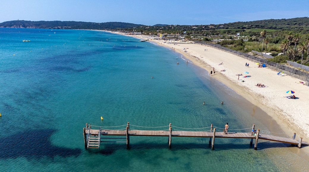 Crystal clear blue water of legendary Pampelonne beach near Saint-Tropez, summer vacation on white sandy beach of French Riviera, France