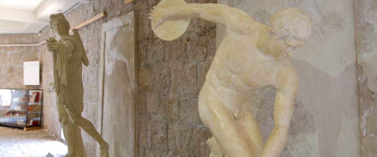 Two classical sculptures in a museum.
