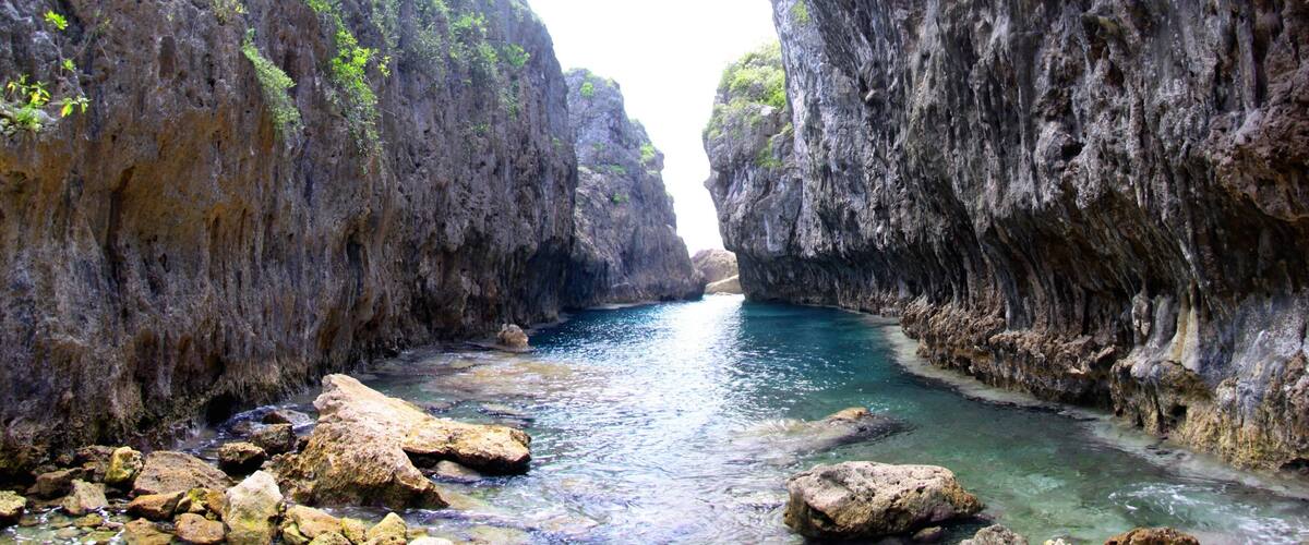 Matapa Chasm showing a gorge or canyon and rocky coastline