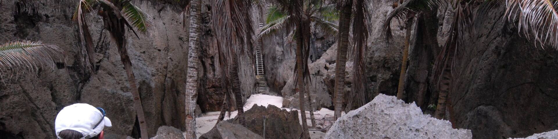Togo Chasm showing hiking or walking and a gorge or canyon as well as an individual male