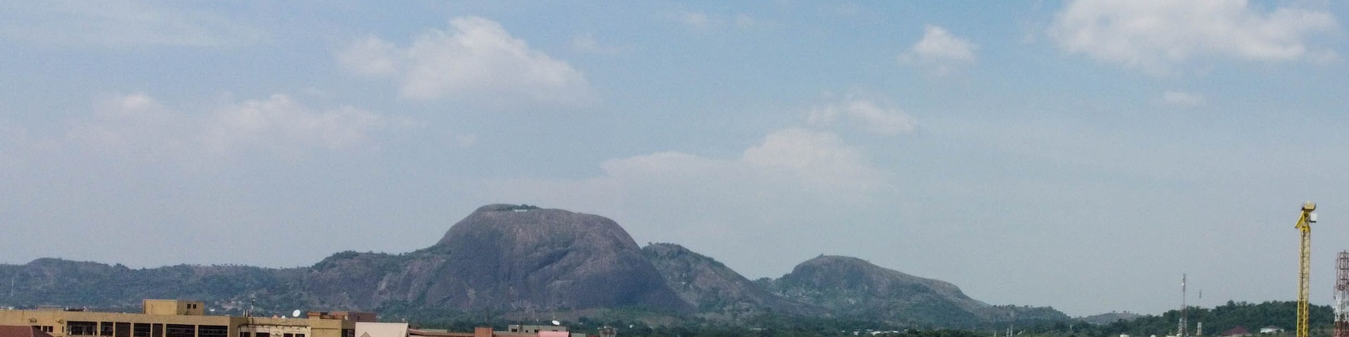 Scenic aerial view of Abuja City with Aso Rock in the background