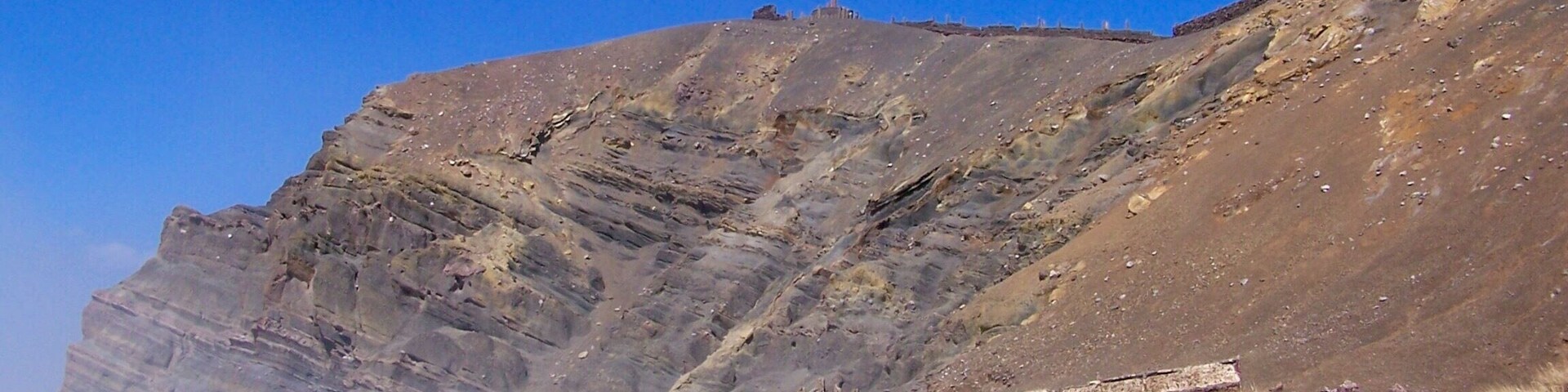 Masaya is located 20 km south of Managua, Nicaragua. It is Nicaragua's first and largest National Park. As you can see off to the left, it is quietly letting you know it's there. If your eyesight is bad, your nose will let you know it too!!