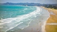Orewa Beach which includes general coastal views, a sandy beach and landscape views