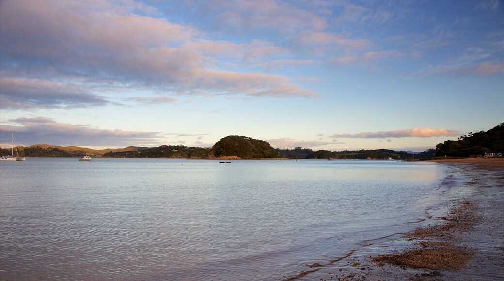 Paihia Beach featuring a bay or harbor, a beach and a sunset