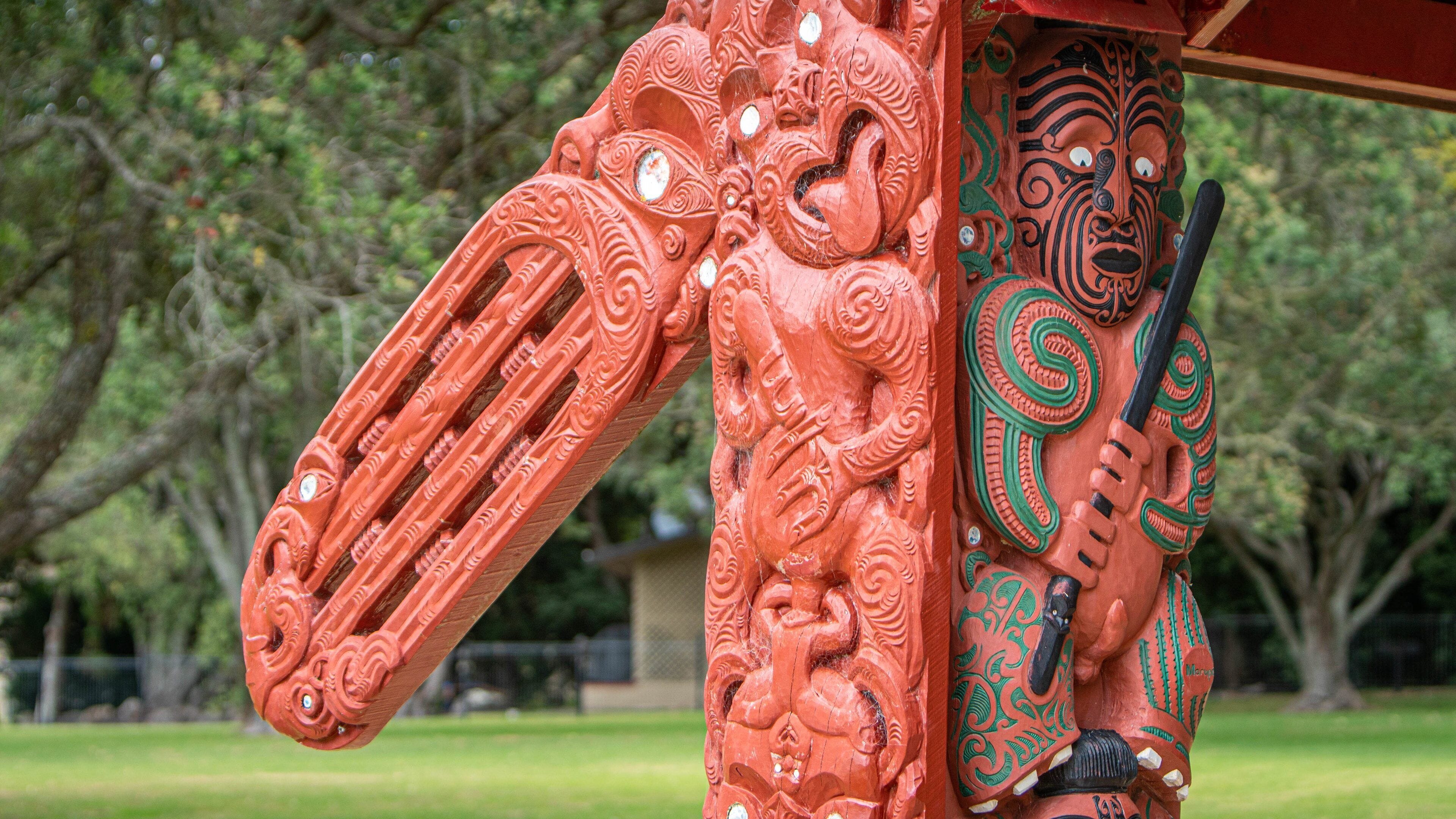A detailed wooden sculpture with intricate carvings.