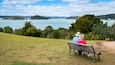 Waitangi Treaty Grounds which includes general coastal views and a park as well as a couple