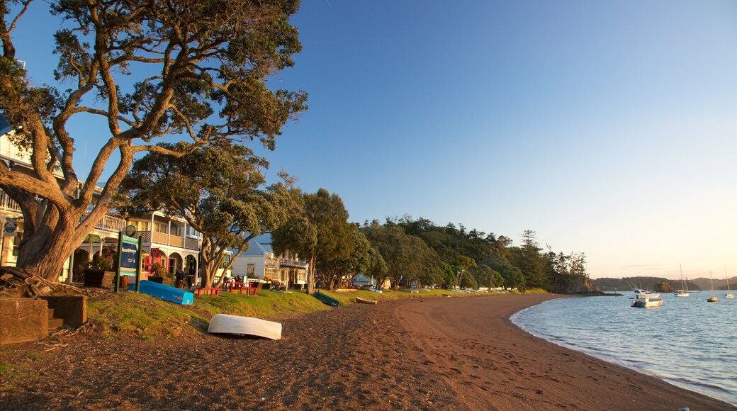 Russell Beach featuring a bay or harbour, a sandy beach and a coastal town