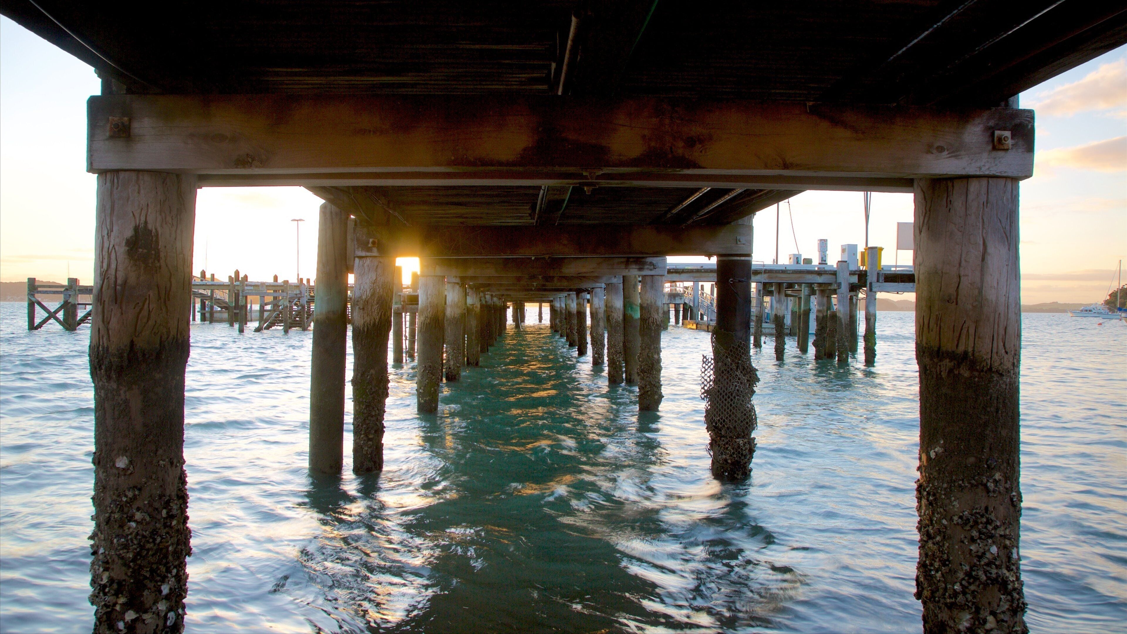 Russell Beach featuring a sunset and a bay or harbor