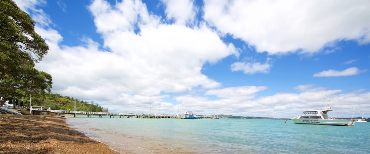 Russell Beach featuring a pebble beach and a bay or harbor