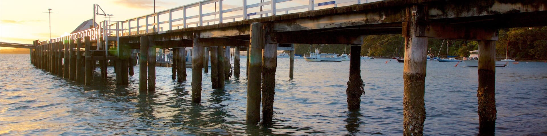 Russell Beach which includes a sunset and a bay or harbor