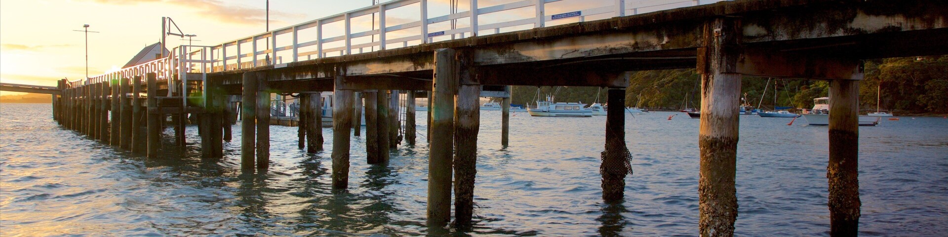 Russell Beach which includes a sunset and a bay or harbor