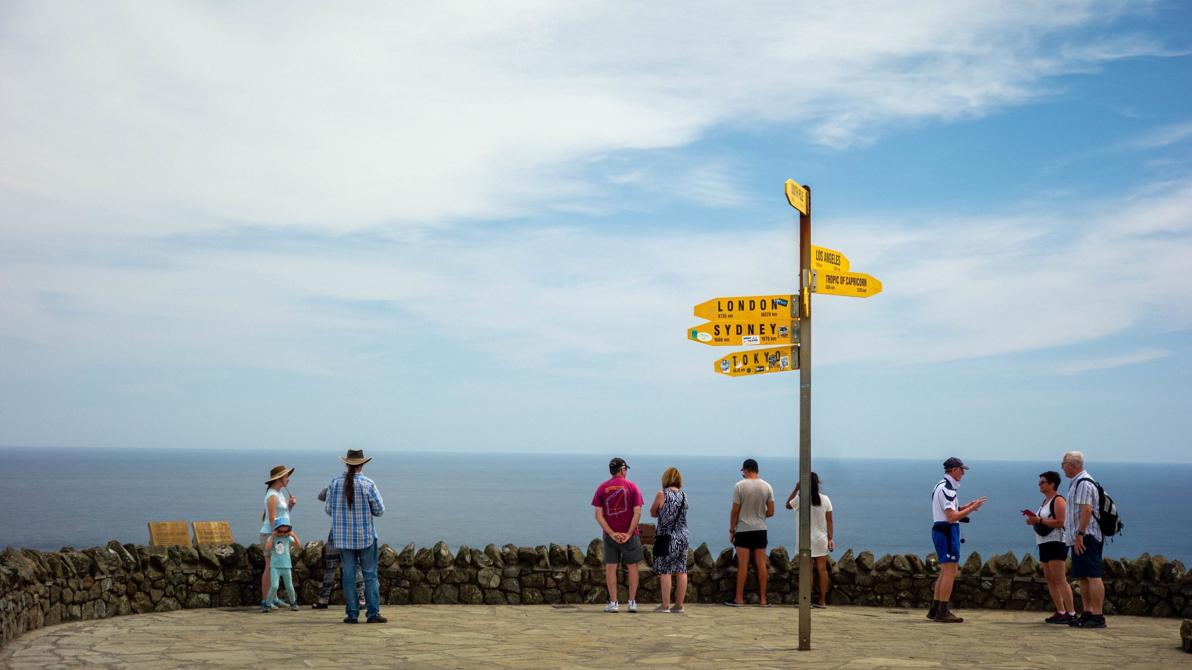 Cape Reinga Lighthouse featuring views, signage and general coastal views