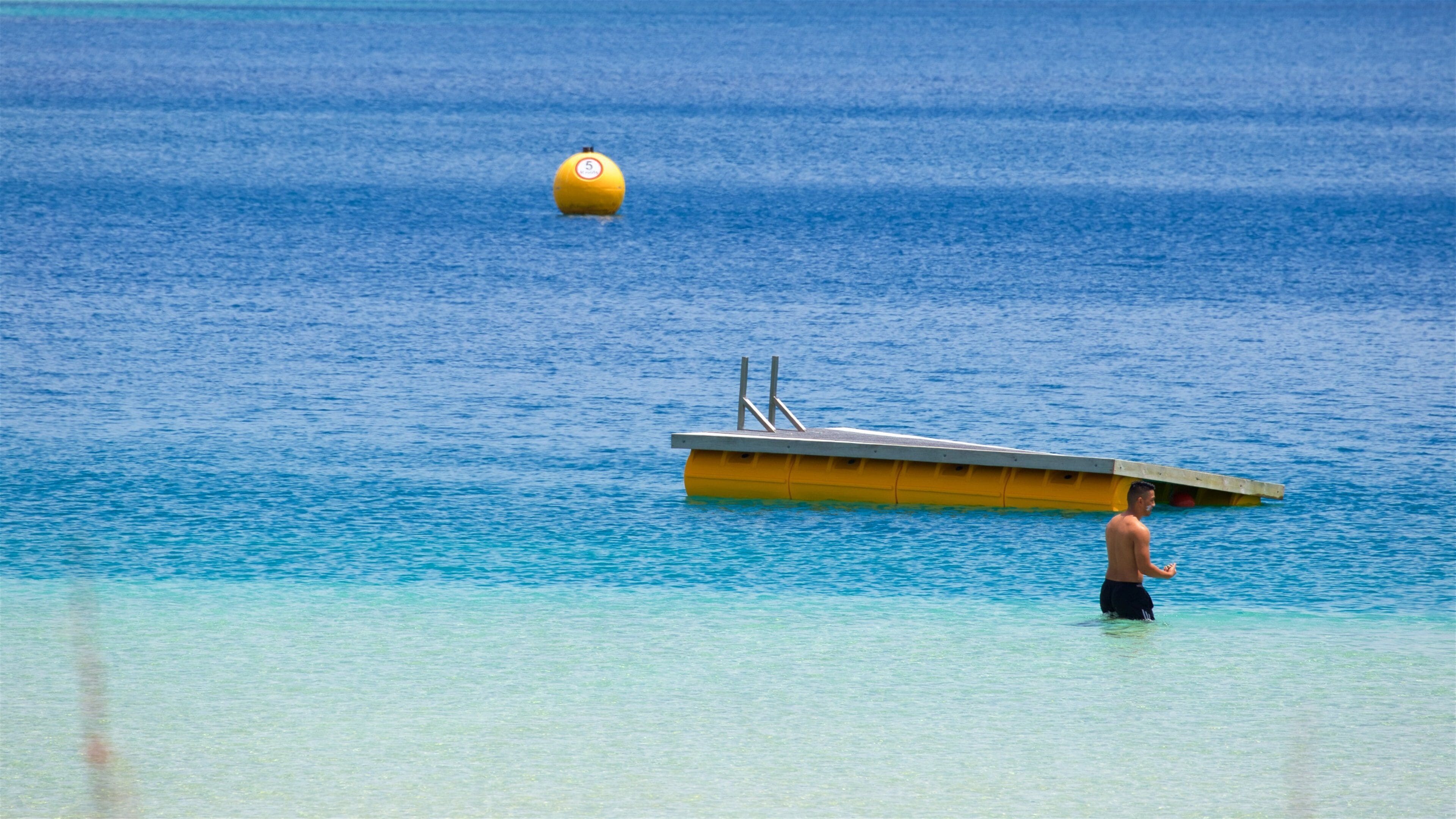 Kai Iwi Lakes featuring a lake or waterhole and swimming as well as an individual male